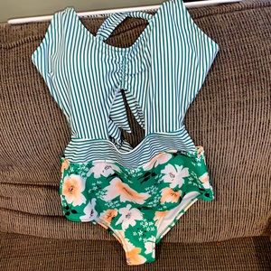 NEVER WORN One piece bathing suit- good bottom coverage!